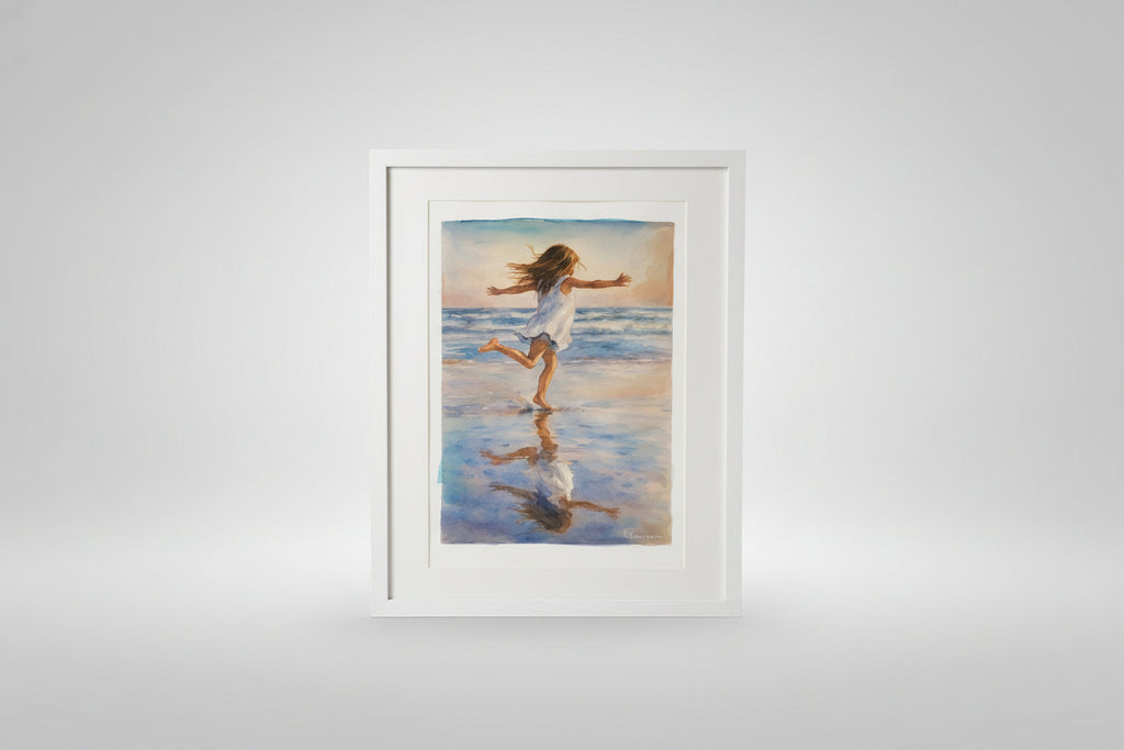 Framed painting of a girl running on a beach