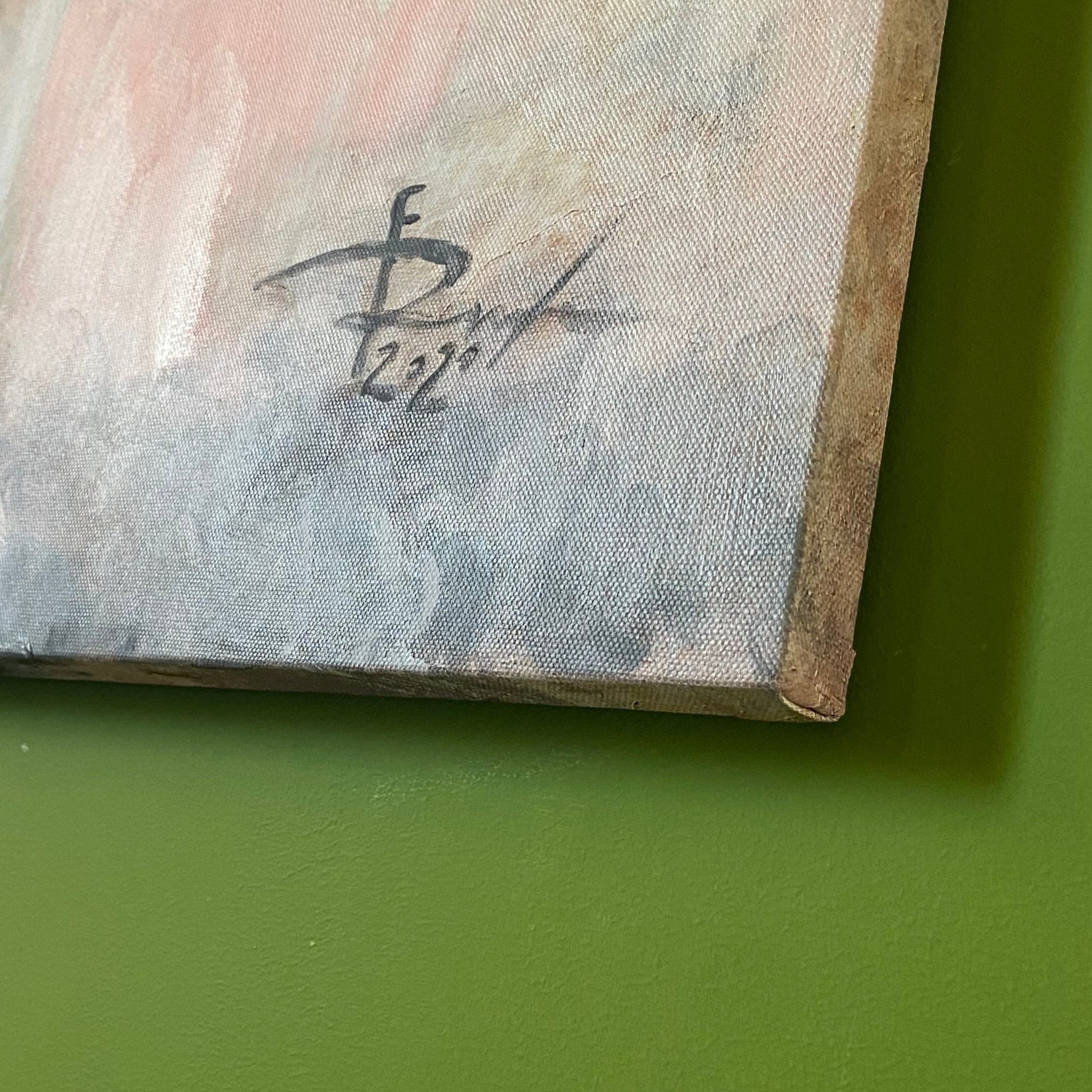 Close-up of a painting with a signature on a green surface Romalenaart