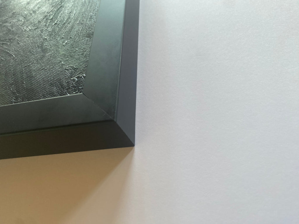 Close-up of a textured frame corner on a white background