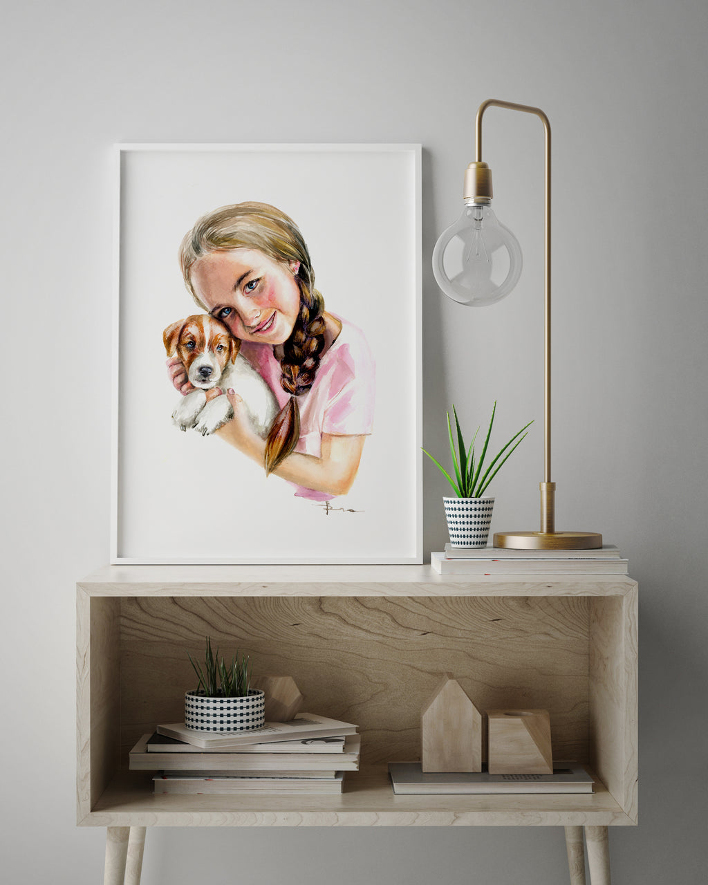 Framed artwork of a girl holding a dog 