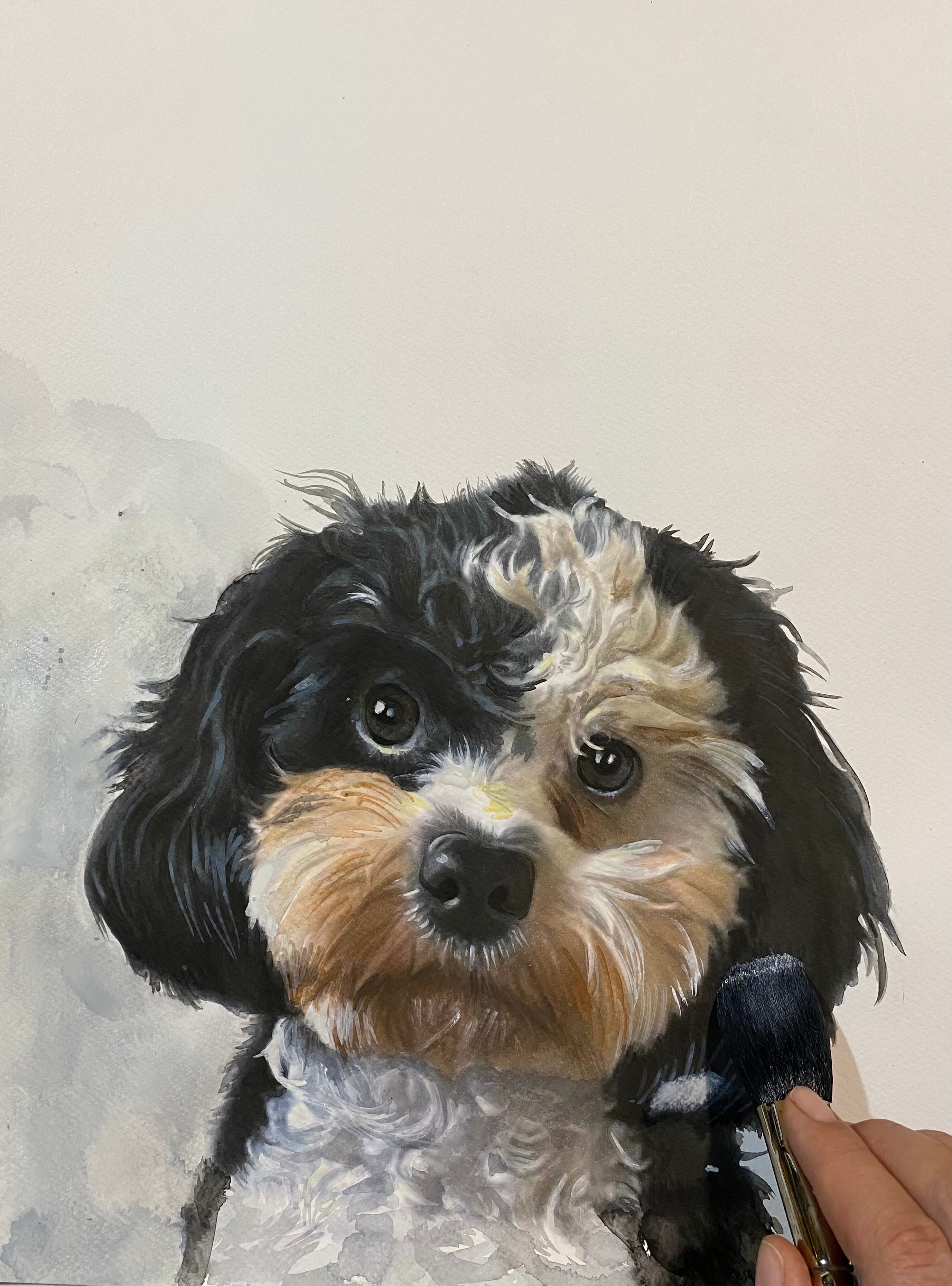 Artistic painting of a dog's head with a brush in hand on a textured background